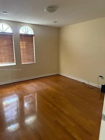 a view of a yard with a palm tree