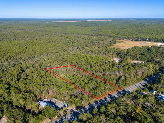 an aerial view of mountain with lake view