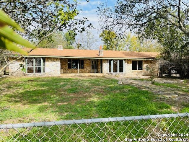 6268 Highway 27 Center Point, TX 78010 - Photo 11 of 39 a front view of a house with a yard