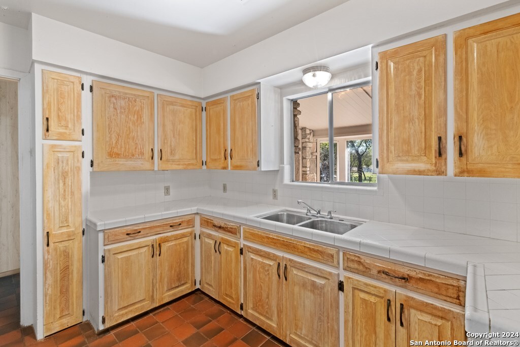 6268 Highway 27 Center Point, TX 78010 - Photo 14 of 39 a kitchen with a sink stove and window