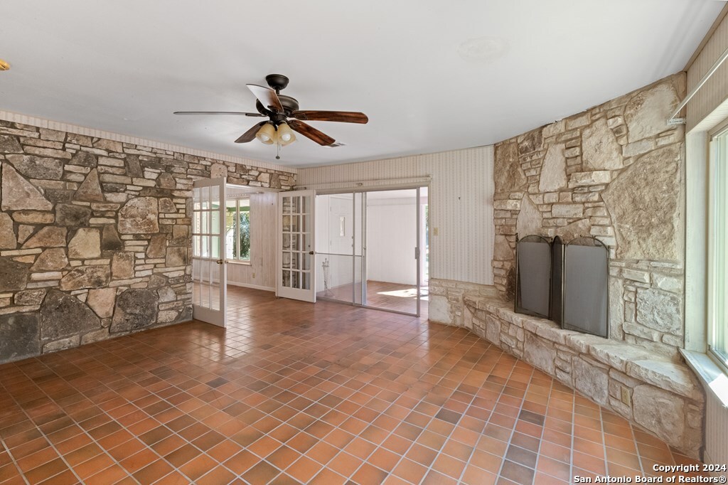 6268 Highway 27 Center Point, TX 78010 - Photo 19 of 39 a view of a livingroom with wooden floor and a ceiling fan