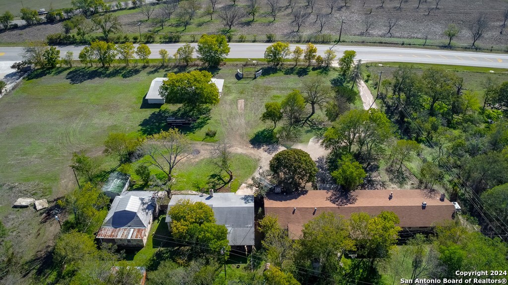 6268 Highway 27 Center Point, TX 78010 - Photo 2 of 39 an aerial view of a house with a yard and lake view