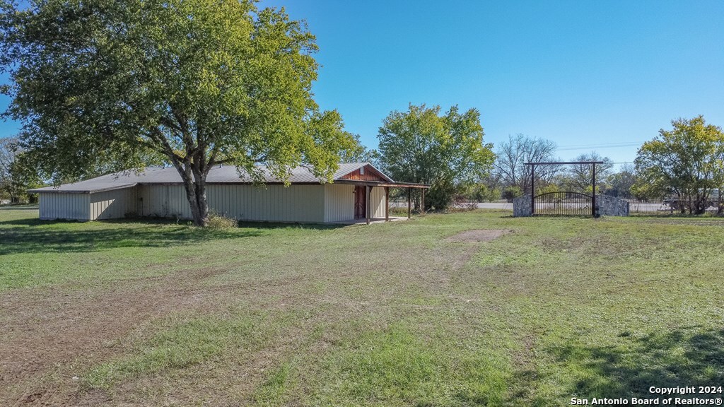 6268 Highway 27 Center Point, TX 78010 - Photo 5 of 39 a house view with a garden