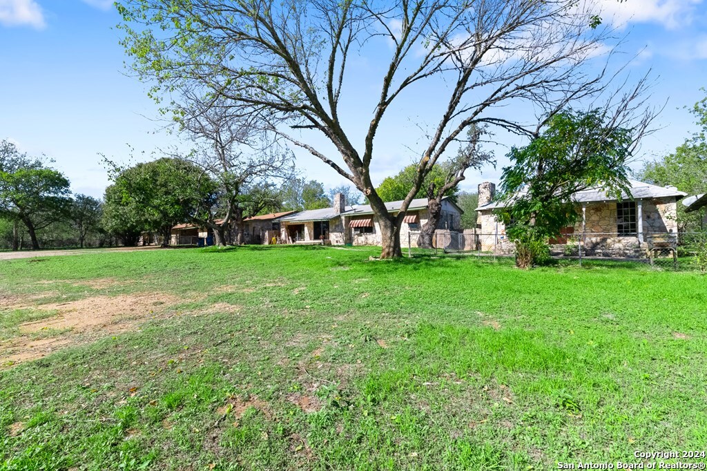 6268 Highway 27 Center Point, TX 78010 - Photo 10 of 39 a view of a house with a big yard