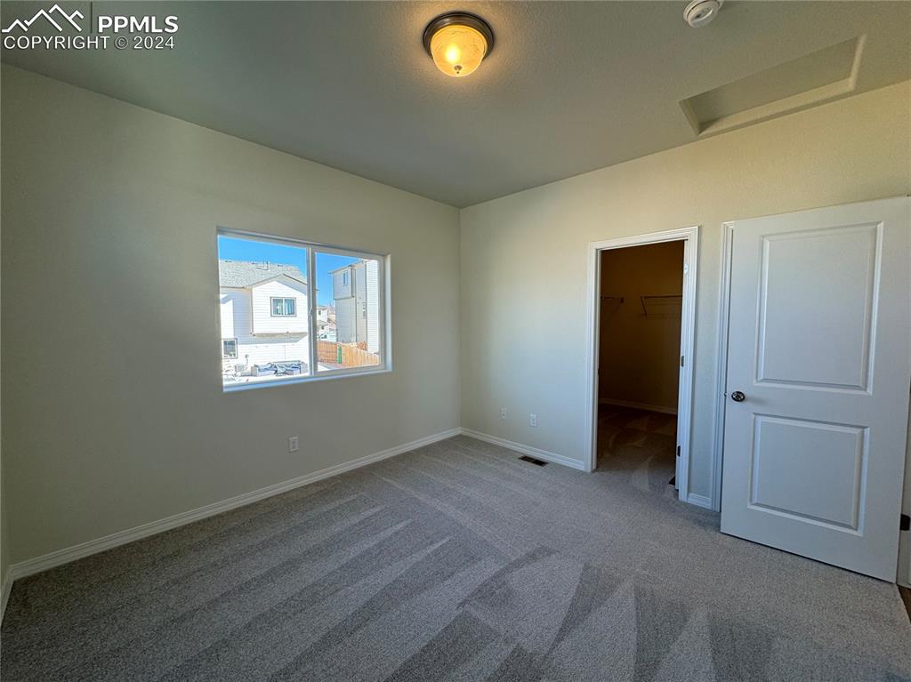8082 Jayla Trail Peyton, CO 80831 - Photo 15 of 20 an empty room with a empty space and windows