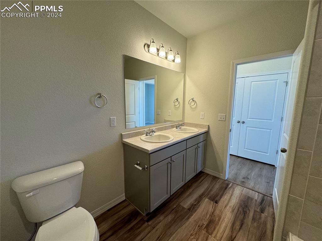 8082 Jayla Trail Peyton, CO 80831 - Photo 18 of 20 a bathroom with a sink and a mirror