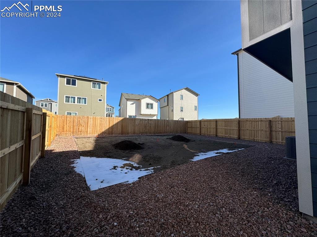 8082 Jayla Trail Peyton, CO 80831 - Photo 2 of 20 a living room with a rug