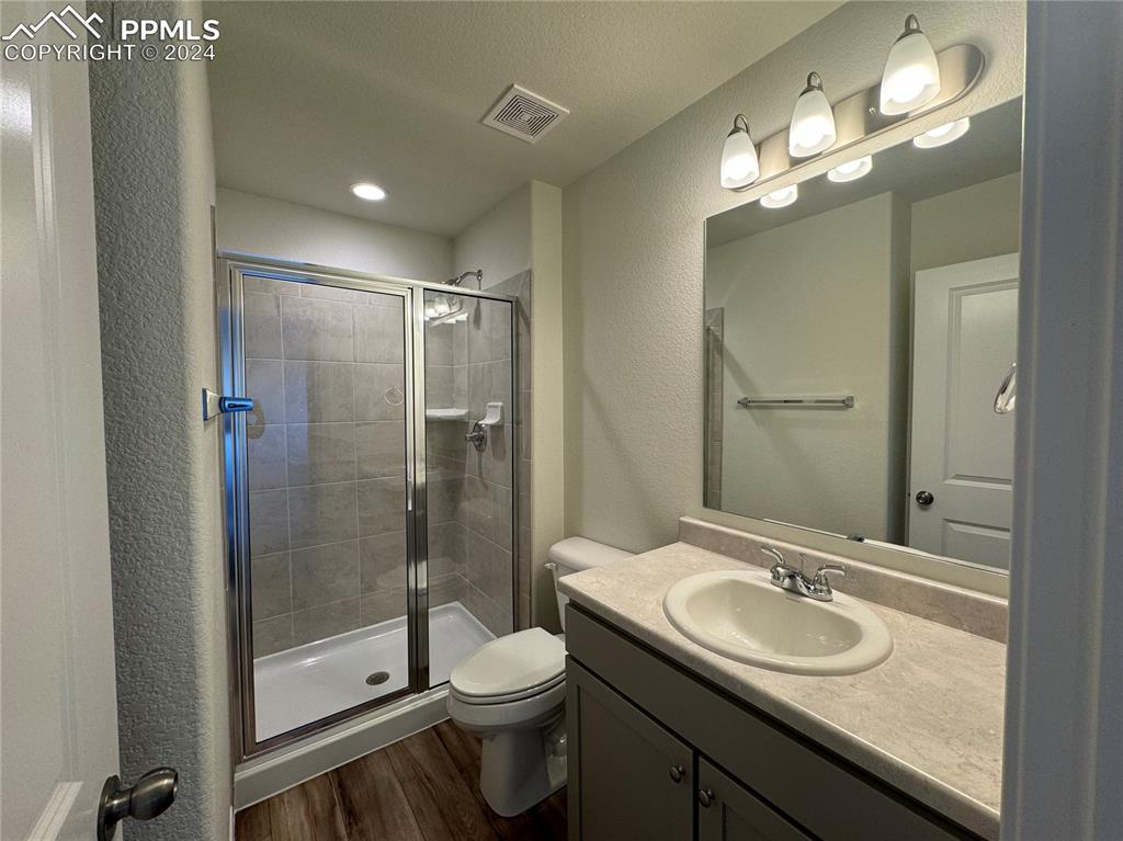8082 Jayla Trail Peyton, CO 80831 - Photo 5 of 20 a bathroom with a sink toilet and shower