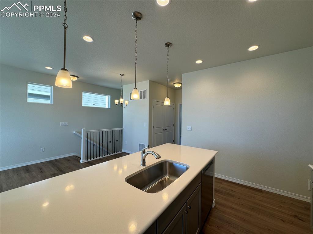 8082 Jayla Trail Peyton, CO 80831 - Photo 10 of 20 a kitchen with a sink and stove