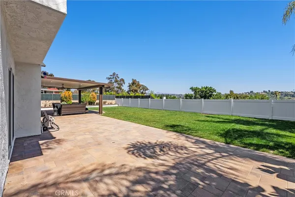 a front view of house with yard and outdoor seating