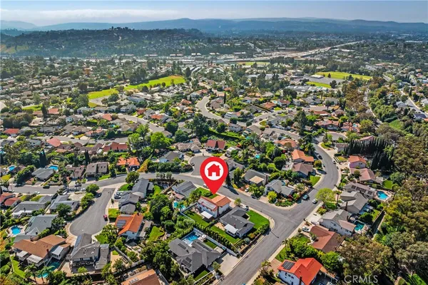 an aerial view of residential building and parking space