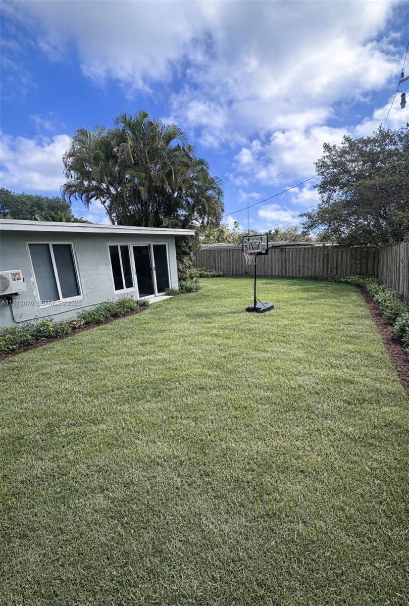 5710 Douglas Street Hollywood, FL 33021 - Photo 19 of 21 a view of outdoor space with deck and yard