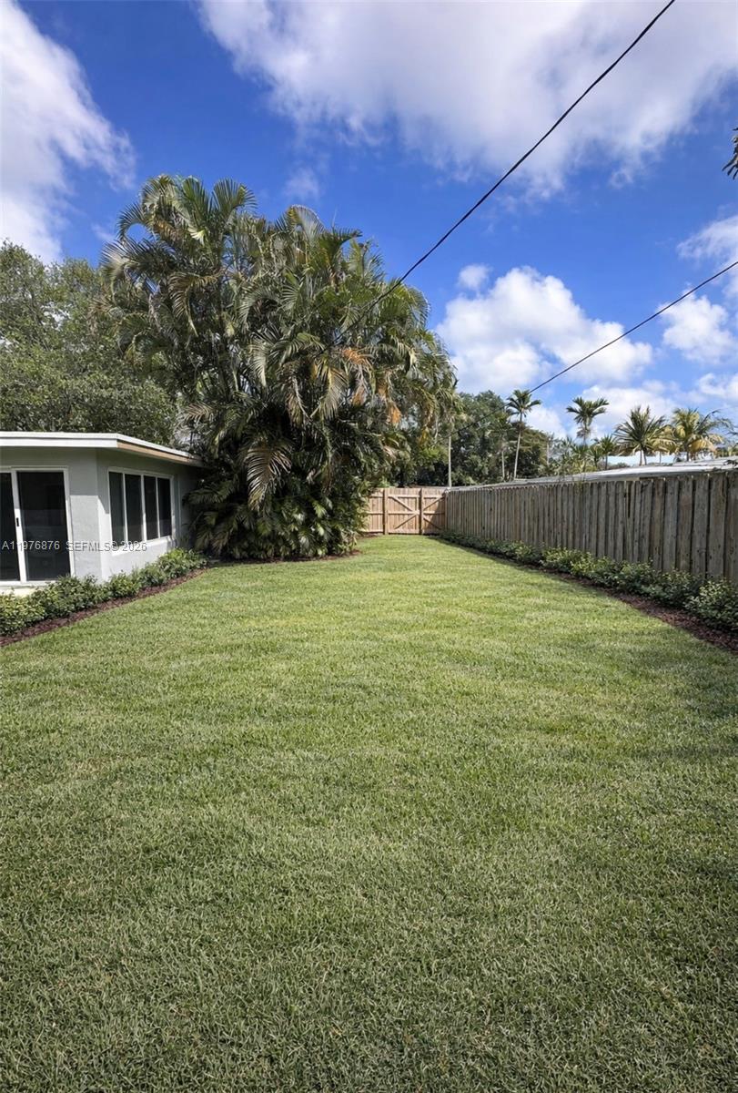 5710 Douglas Street Hollywood, FL 33021 - Photo 20 of 21 a view of a house with a yard
