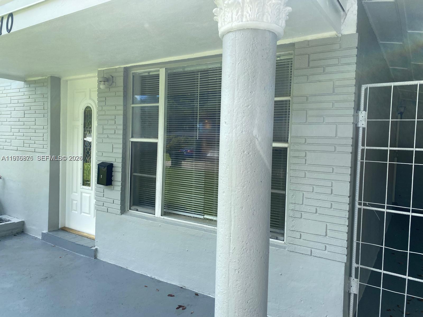 5710 Douglas Street Hollywood, FL 33021 - Photo 2 of 21 a view of potted plant in front of a door