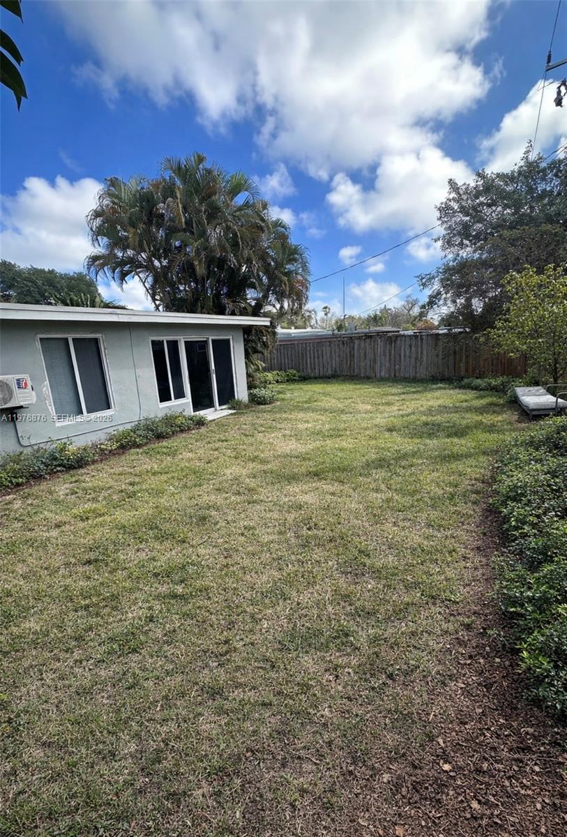5710 Douglas Street Hollywood, FL 33021 - Photo 21 of 21 a view of a house with a yard