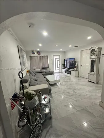 a kitchen with sink refrigerator and stove