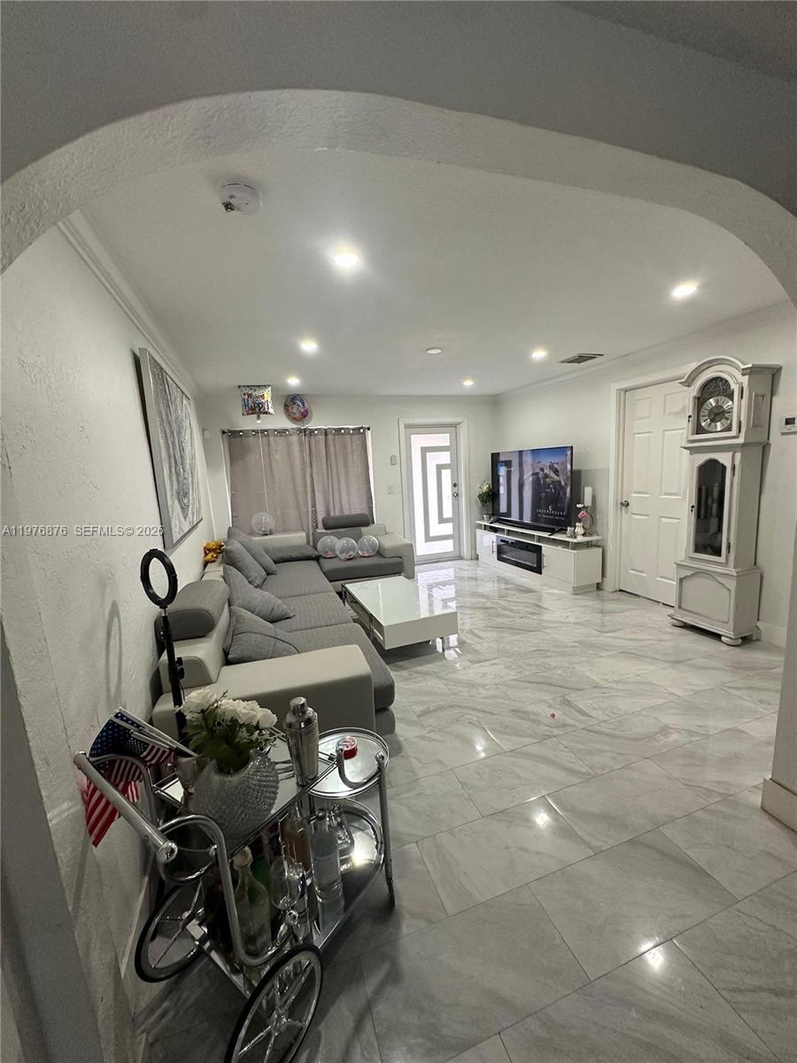 5710 Douglas Street Hollywood, FL 33021 - Photo 6 of 21 a view of a room with gym equipment
