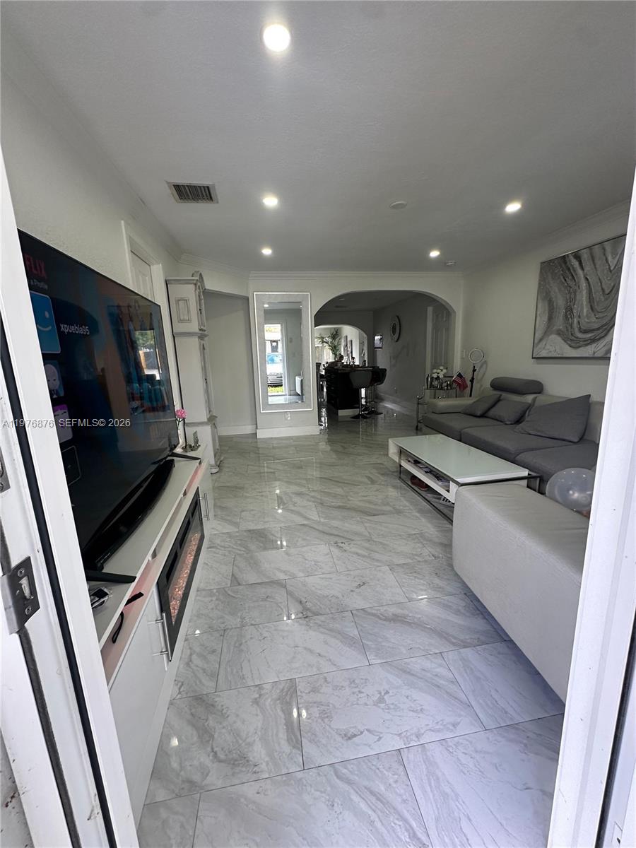5710 Douglas Street Hollywood, FL 33021 - Photo 7 of 21 a kitchen with sink refrigerator and stove
