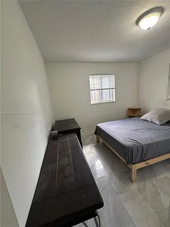a room with gym equipment and a large window