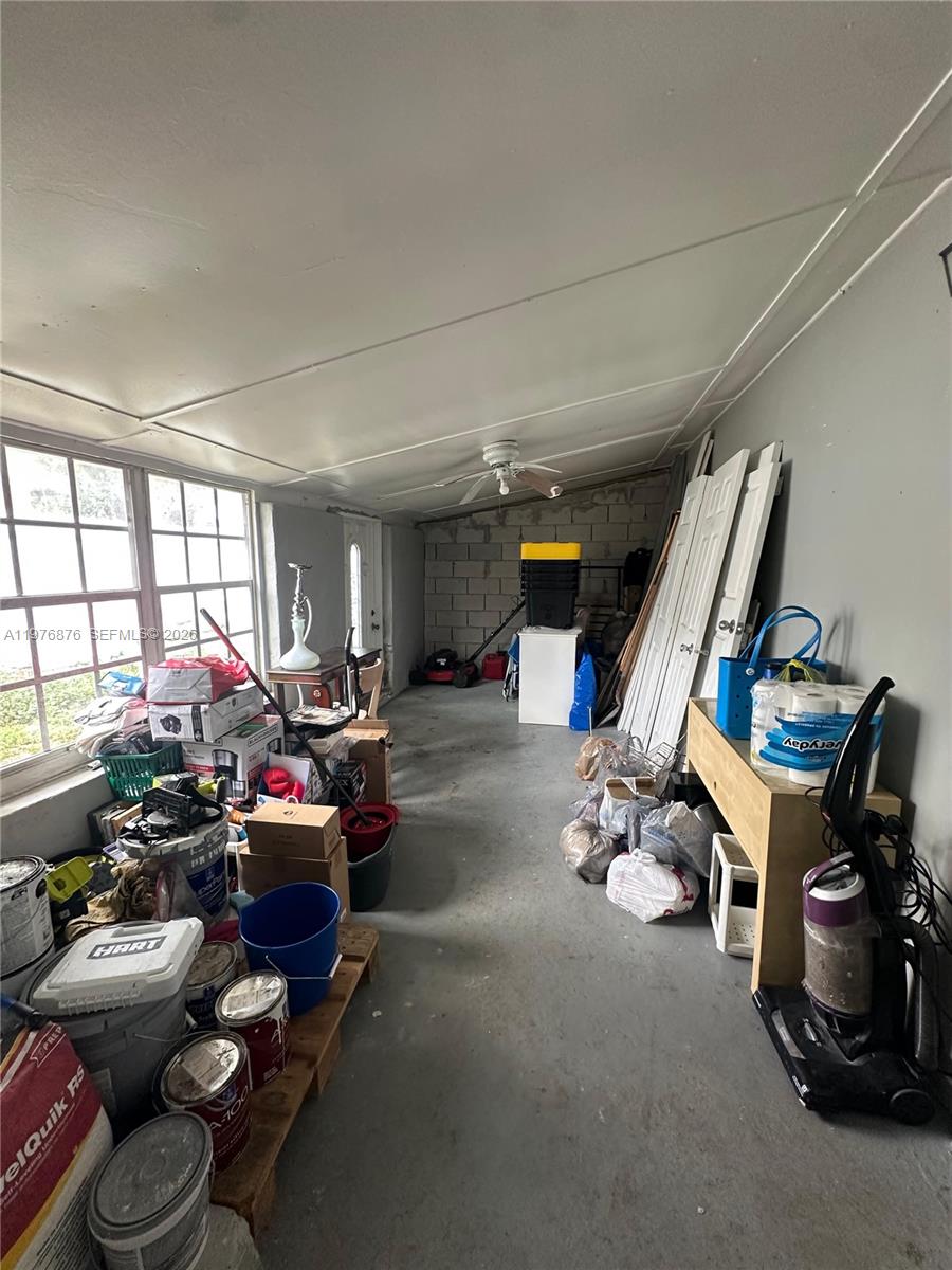 5710 Douglas Street Hollywood, FL 33021 - Photo 9 of 21 a room with gym equipment and a large window