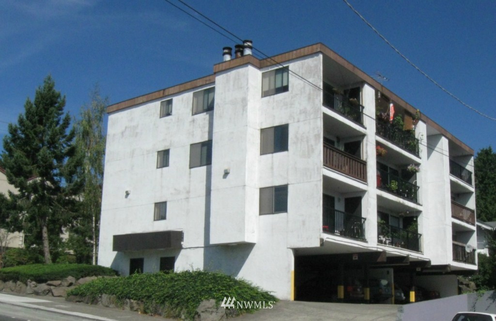 8500 Linden Avenue North Seattle, WA 98103 - Photo 1 of 17 a large building with a lot of windows