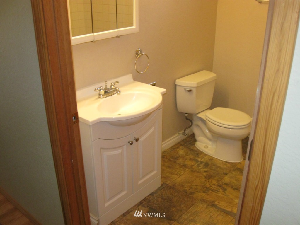 8500 Linden Avenue North Seattle, WA 98103 - Photo 12 of 17 a bathroom with a toilet and a sink
