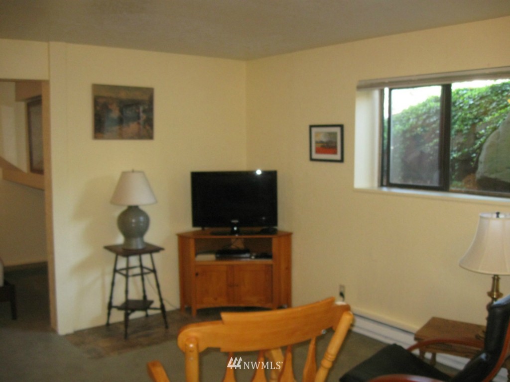 8500 Linden Avenue North Seattle, WA 98103 - Photo 13 of 17 a living room with furniture and a flat screen tv