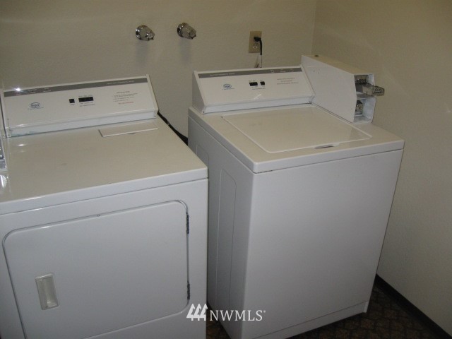 8500 Linden Avenue North Seattle, WA 98103 - Photo 14 of 17 a utility room with dryer and washer