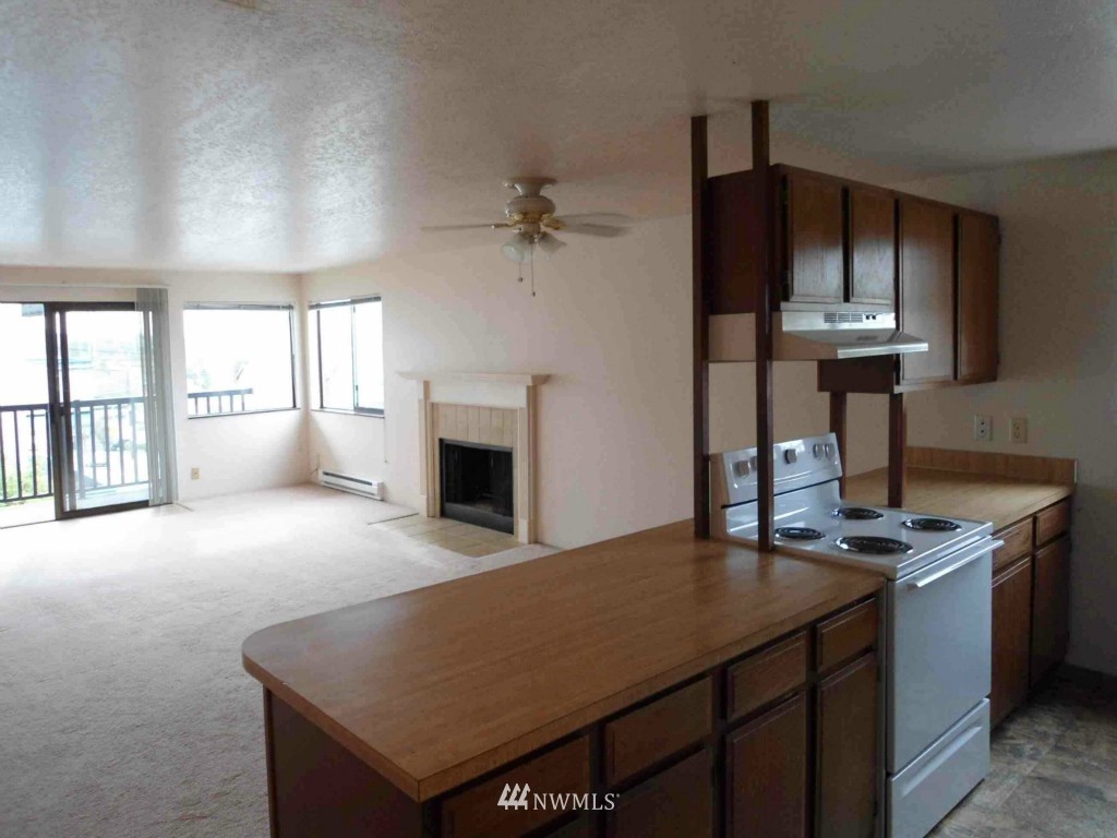 8500 Linden Avenue North Seattle, WA 98103 - Photo 4 of 17 a view of kitchen with furniture and fireplace