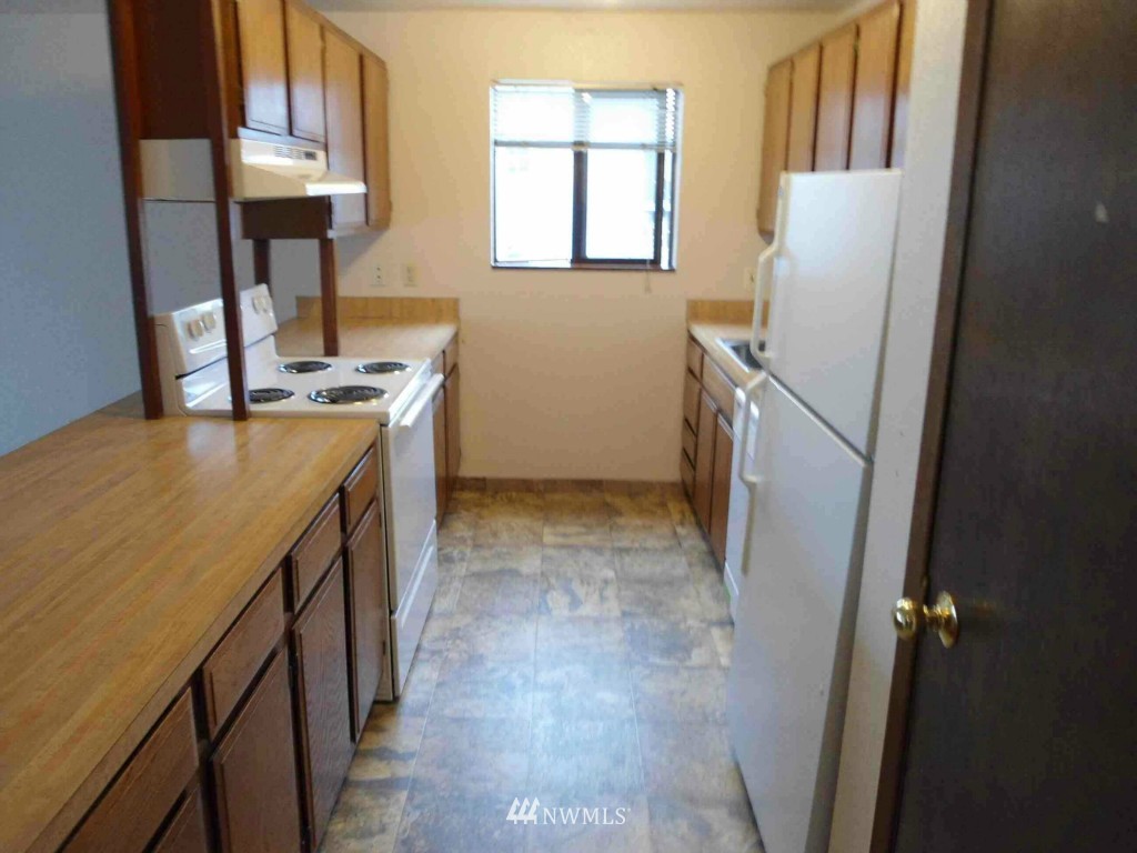 8500 Linden Avenue North Seattle, WA 98103 - Photo 6 of 17 a utility room with a sink a washer and dryer