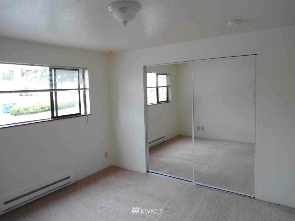 8500 Linden Avenue North Seattle, WA 98103 - Photo 7 of 17 an empty room with windows and closet