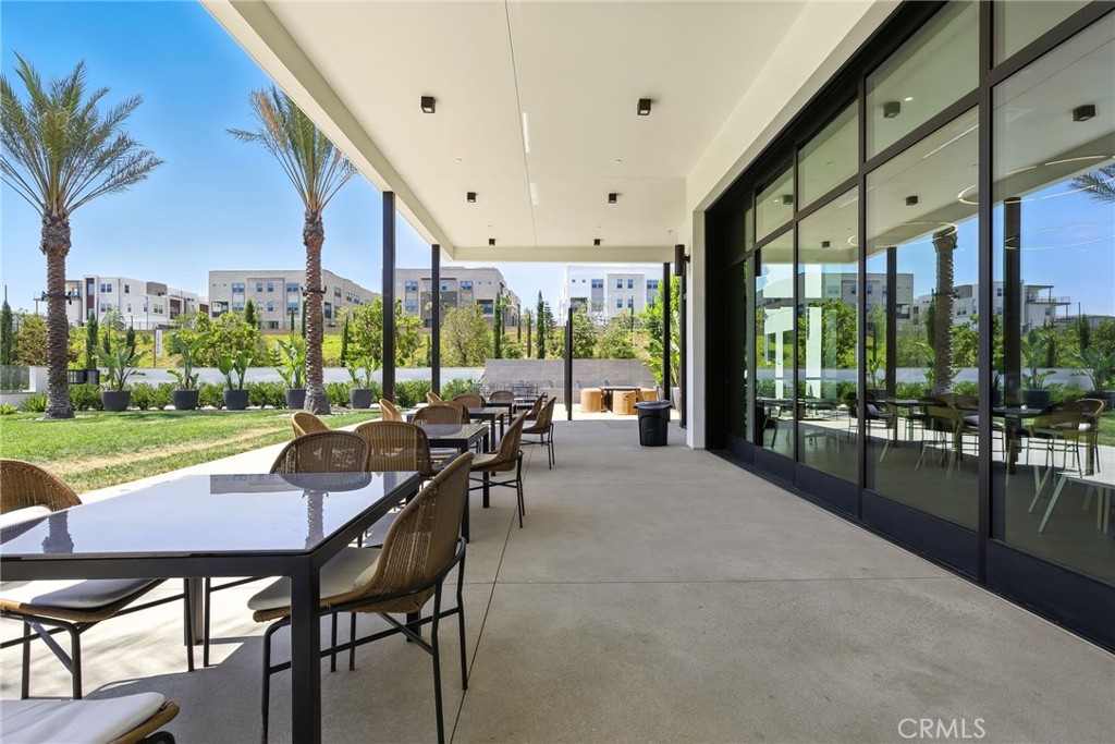 615 Sage Way Montebello, CA 90640 - Photo 7 of 23 a view of a patio with a dining table and chairs