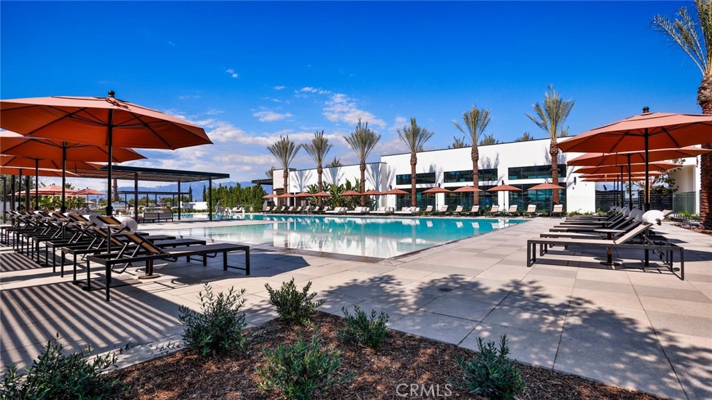 615 Sage Way Montebello, CA 90640 - Photo 10 of 23 a view of a lake with a table and chairs under an umbrella