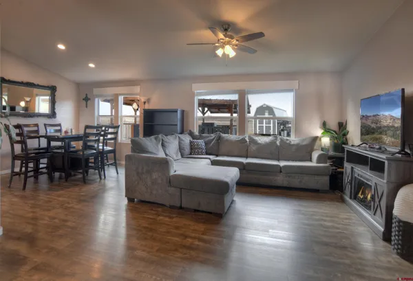 a living room with furniture and a flat screen tv