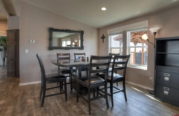 a dining room with furniture and window