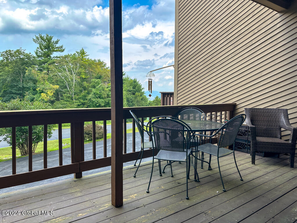 441 Lockhart Mountain Road, Unit 1 Lake George, NY 12845 - Photo 17 of 43 Wrap around deck