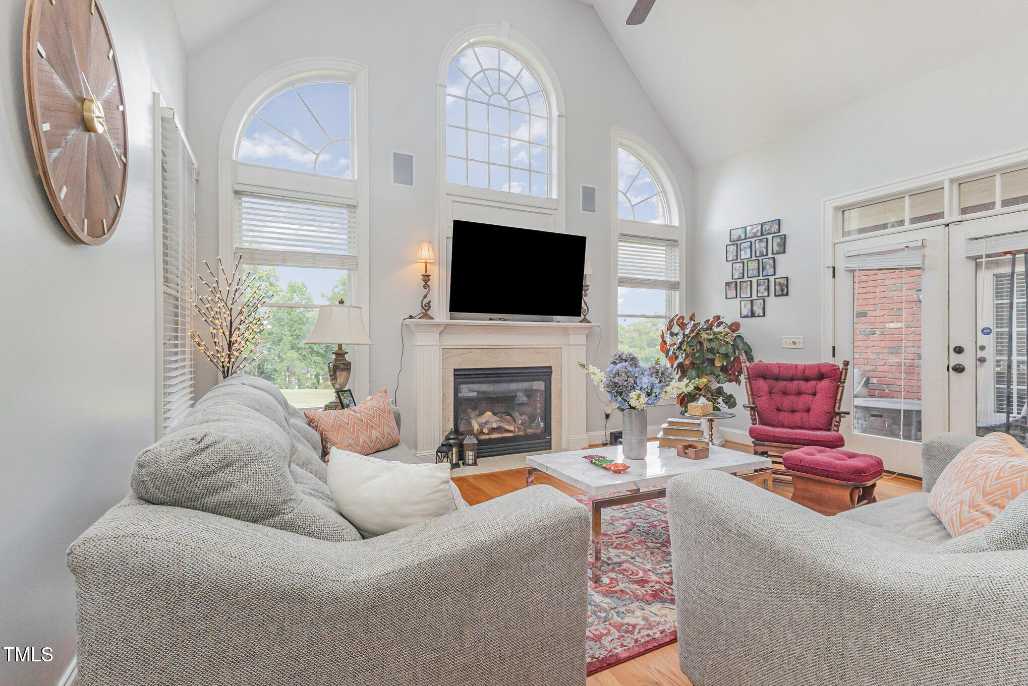12617 Richmond Run Drive Raleigh, NC 27614 - Photo 13 of 77 a living room with furniture a fireplace and a flat screen tv
