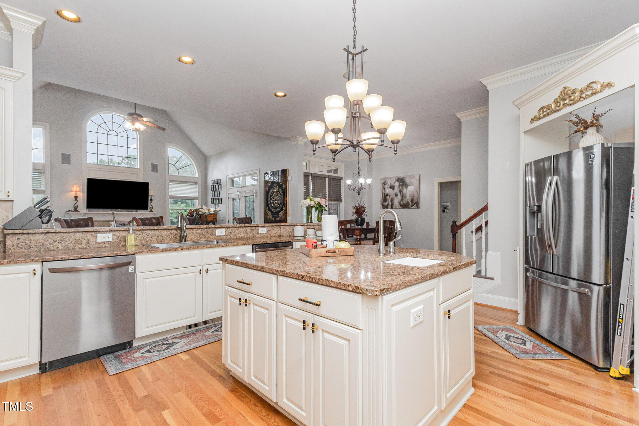 12617 Richmond Run Drive Raleigh, NC 27614 - Photo 20 of 77 a kitchen that has a lot of cabinets and refrigerator