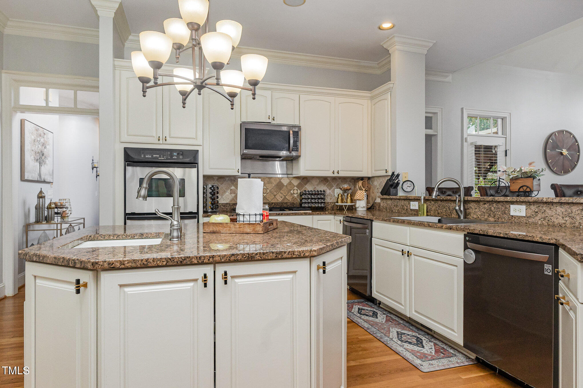 12617 Richmond Run Drive Raleigh, NC 27614 - Photo 21 of 77 a kitchen with cabinets a sink and stainless steel appliances