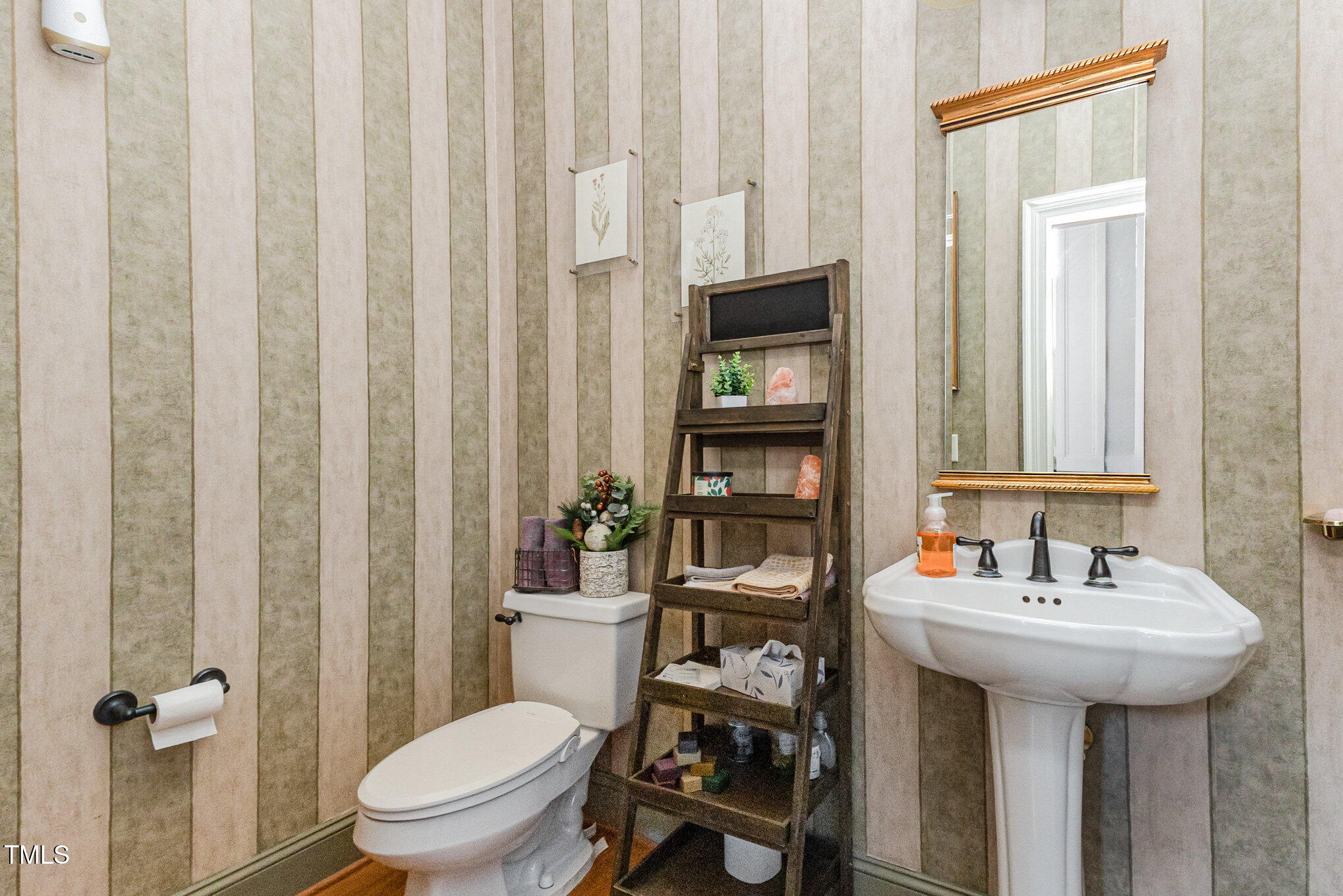 12617 Richmond Run Drive Raleigh, NC 27614 - Photo 24 of 77 a bathroom with a sink a toilet and shower curtain