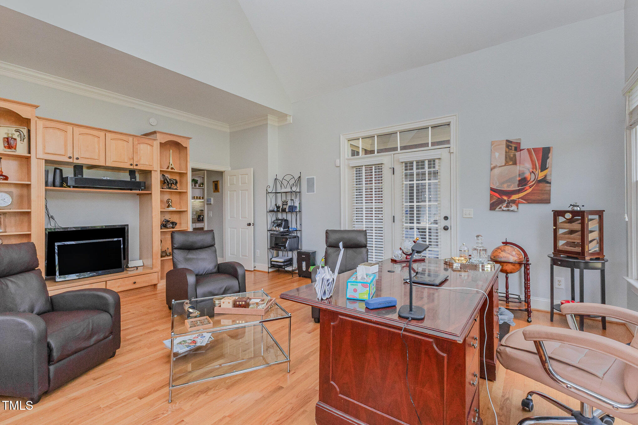 12617 Richmond Run Drive Raleigh, NC 27614 - Photo 26 of 77 a work room with furniture a flat screen tv and a fireplace