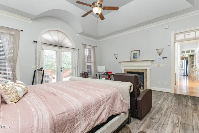 a spacious bedroom with a bed and a table