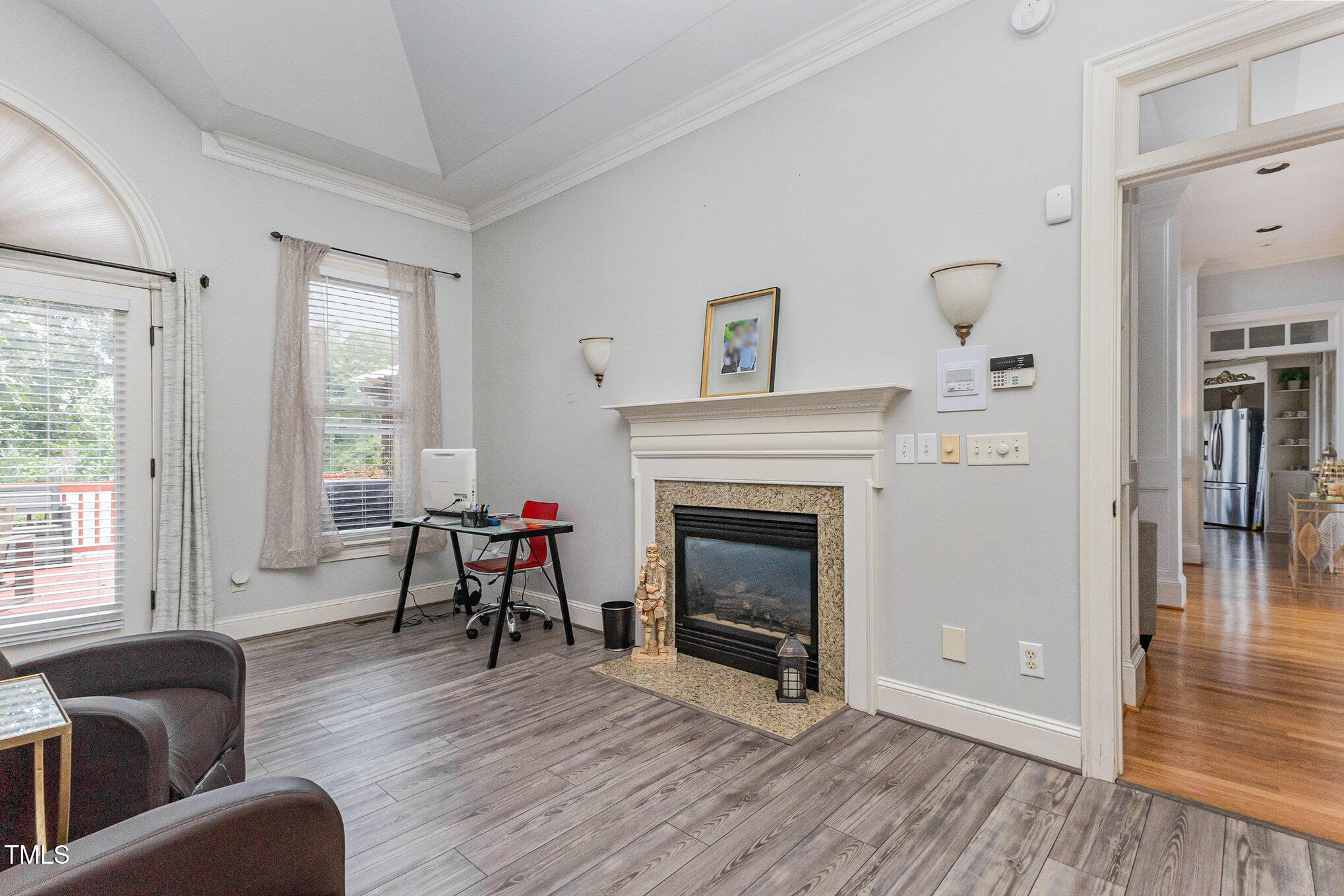 12617 Richmond Run Drive Raleigh, NC 27614 - Photo 33 of 77 a living room with furniture and a fireplace