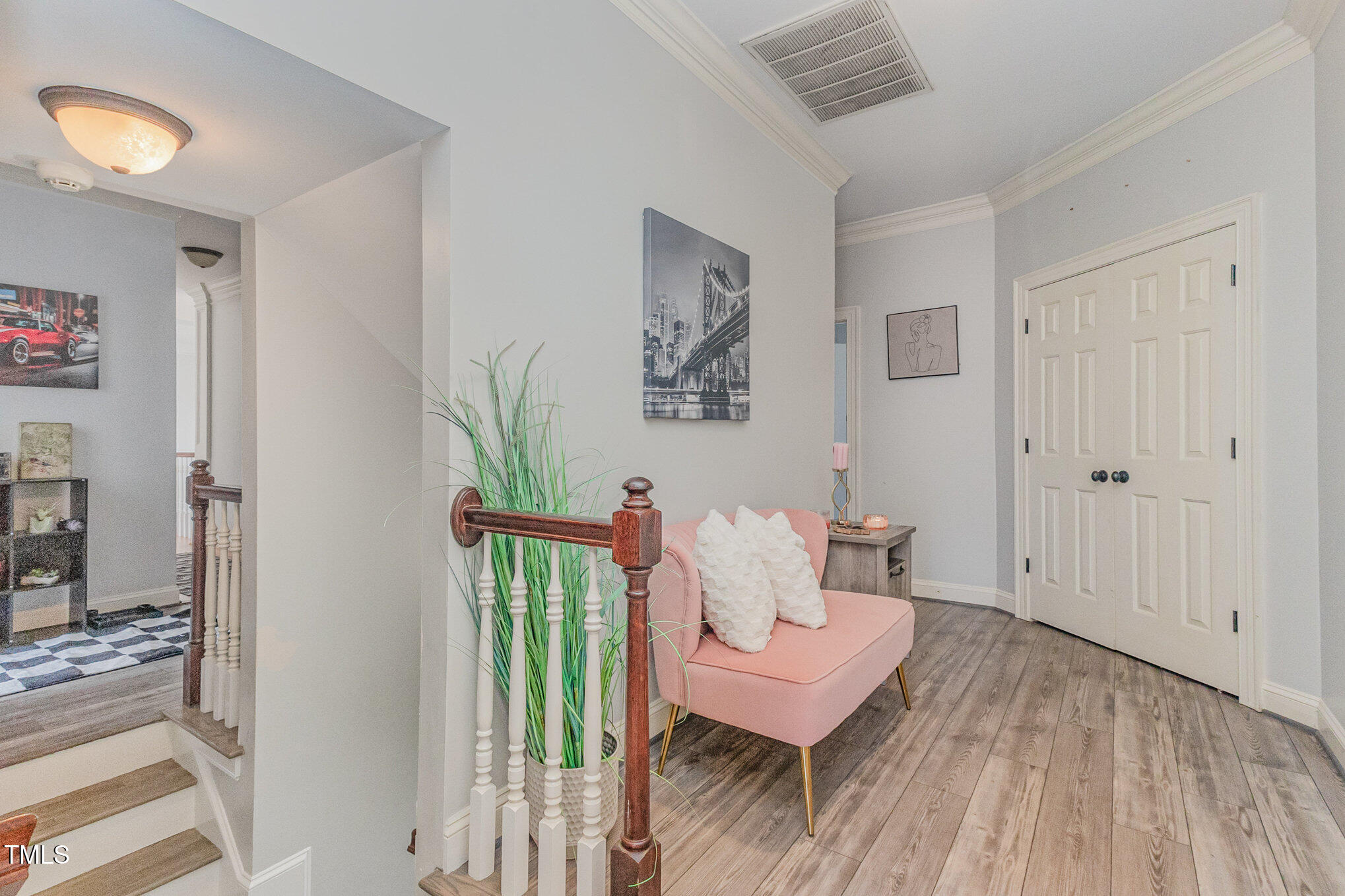 12617 Richmond Run Drive Raleigh, NC 27614 - Photo 38 of 77 a living room with furniture and a wooden floor