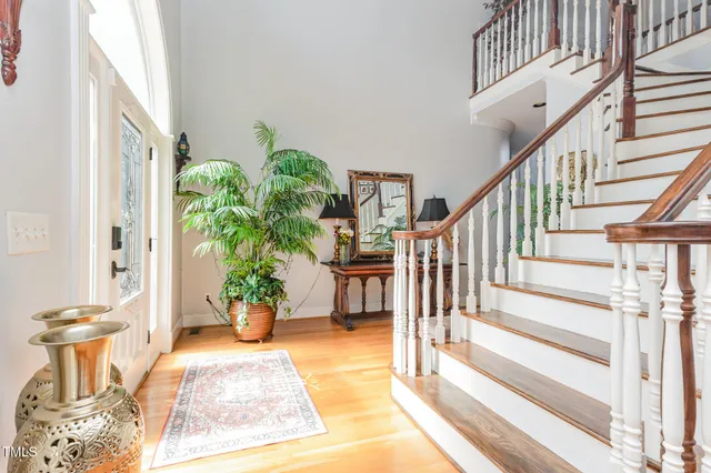 a view of entryway with wooden floor and a rug