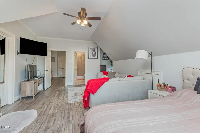 a view of a patio with couches table and chairs and potted plants