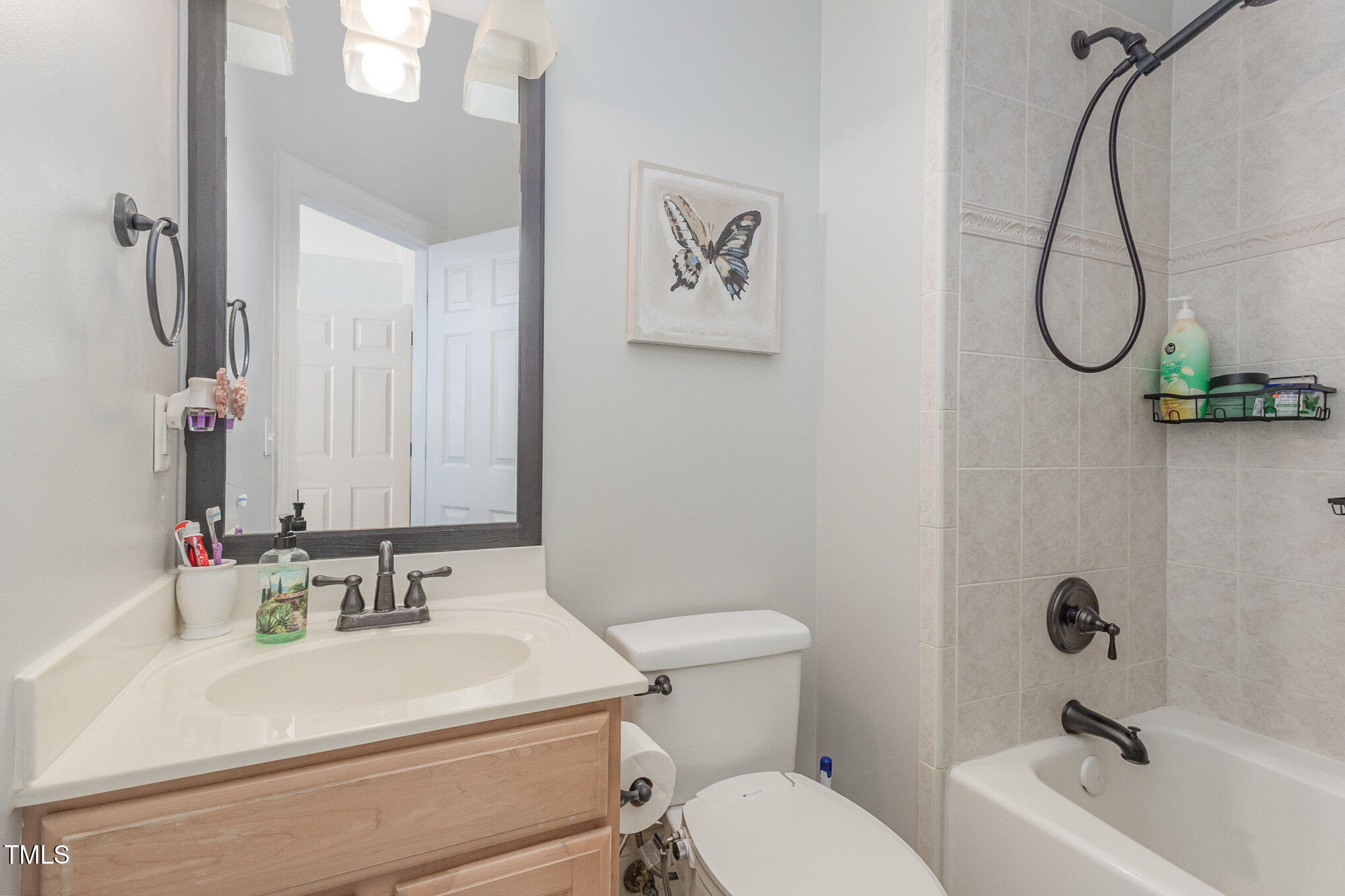 12617 Richmond Run Drive Raleigh, NC 27614 - Photo 49 of 77 a bathroom with a sink a toilet and a mirror