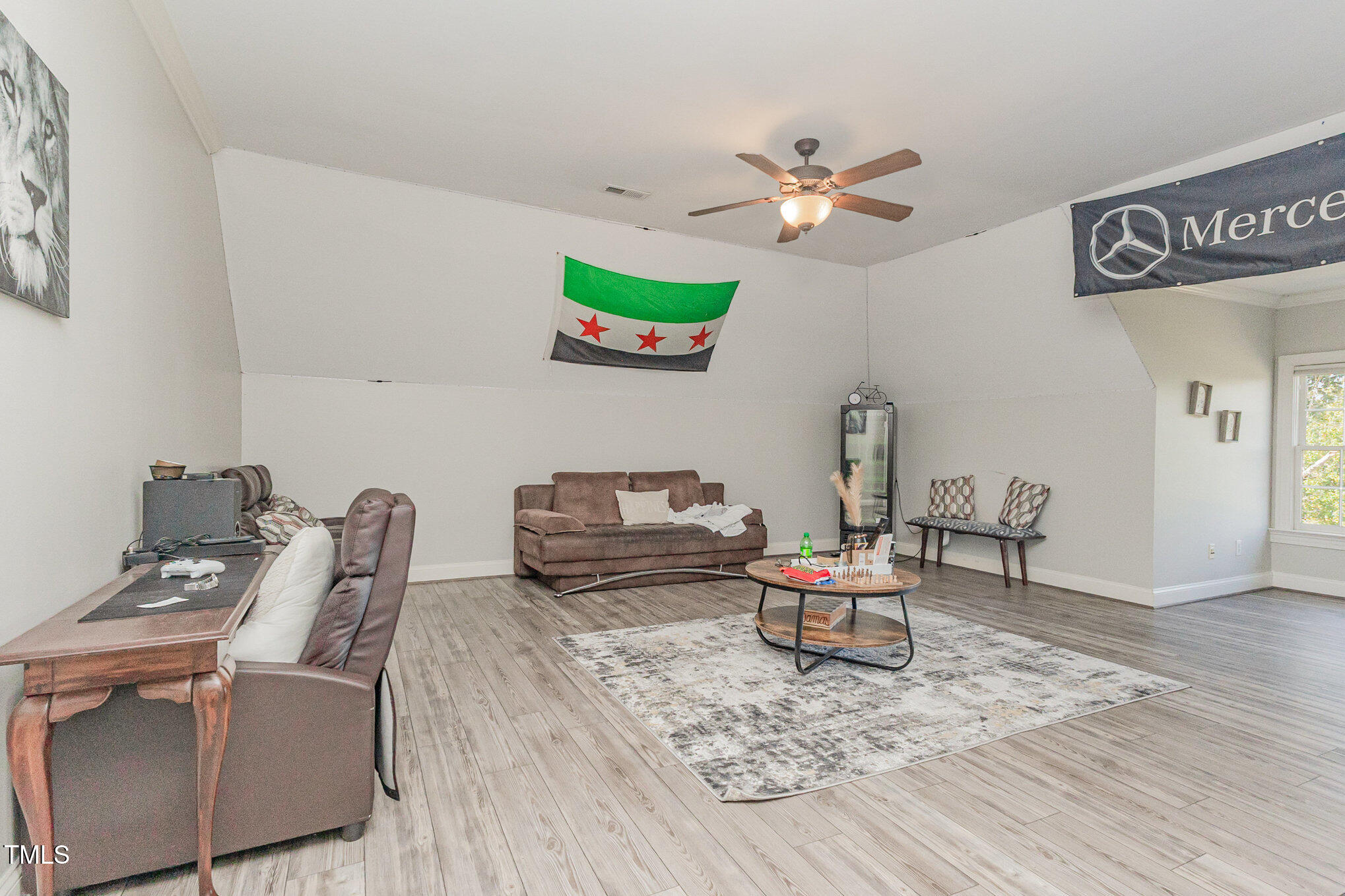12617 Richmond Run Drive Raleigh, NC 27614 - Photo 51 of 77 a living room with furniture and a wooden floor