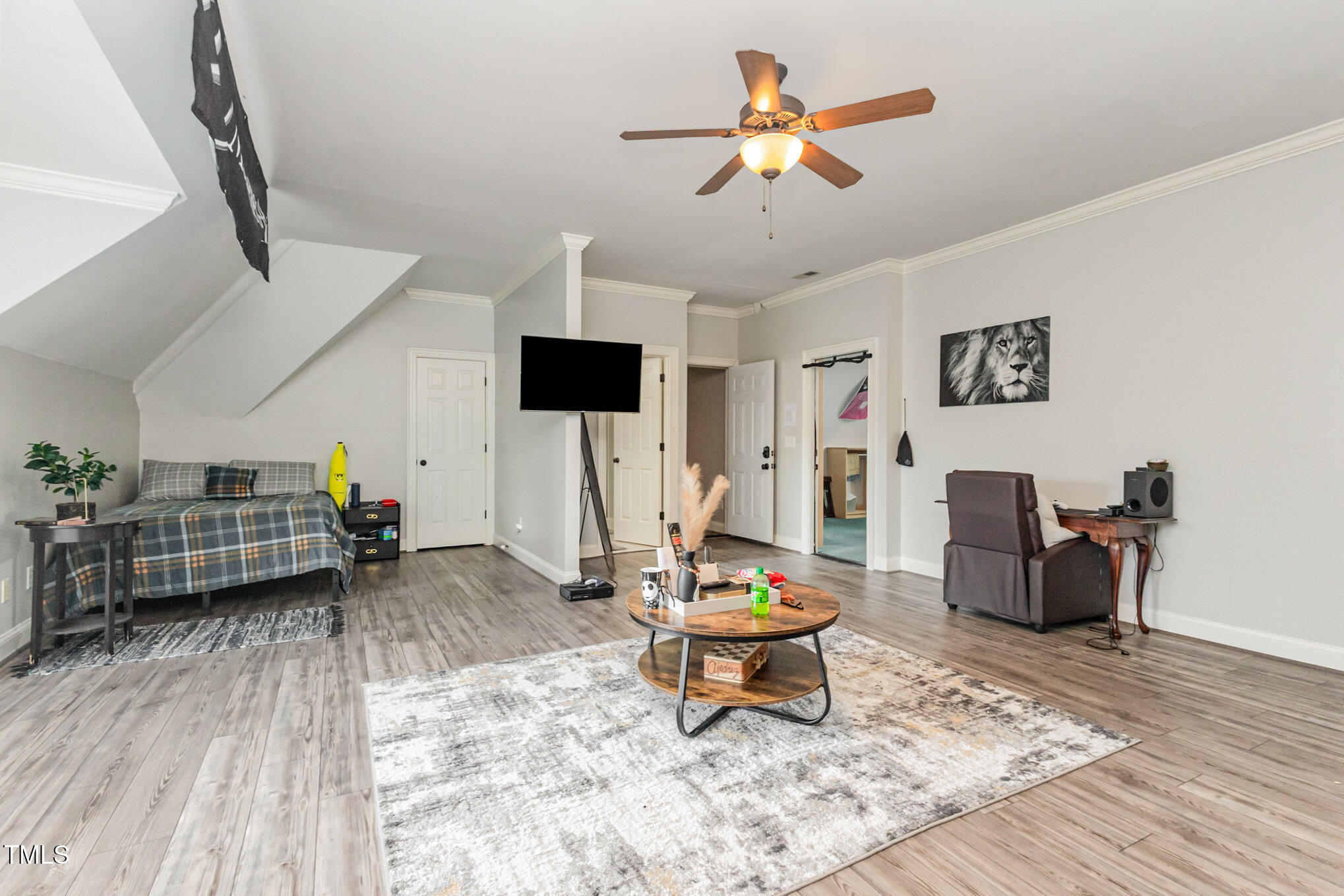 12617 Richmond Run Drive Raleigh, NC 27614 - Photo 53 of 77 a living room with furniture and a wooden floor