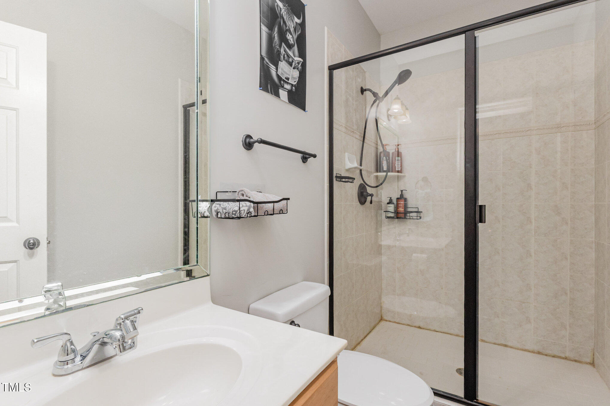 12617 Richmond Run Drive Raleigh, NC 27614 - Photo 56 of 77 a bathroom with a sink toilet and shower